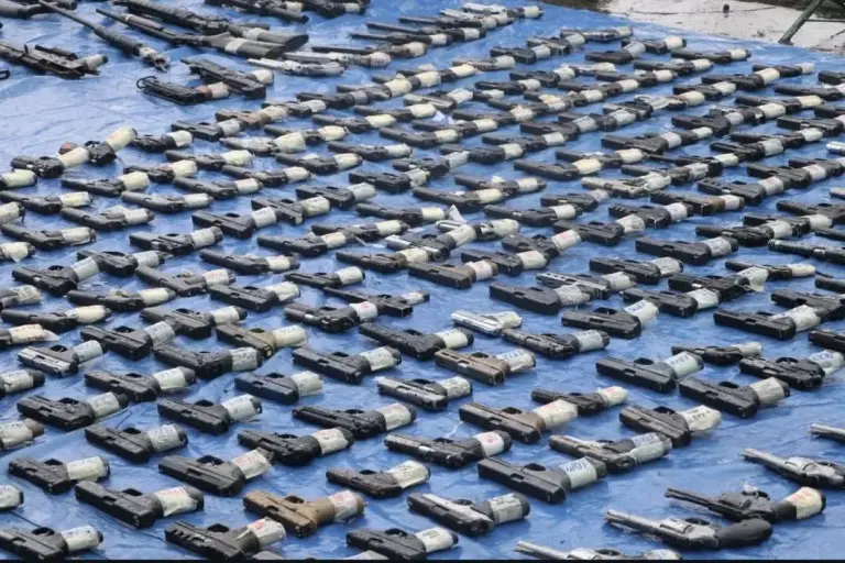Panama Destroys Nearly 100000 Firearms and Weapons in Security Push arms on floor