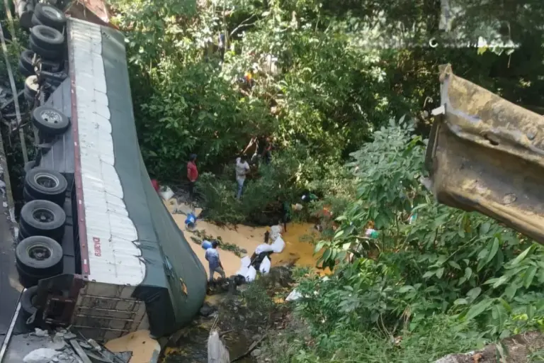 truck and bridge collapse with corn spill