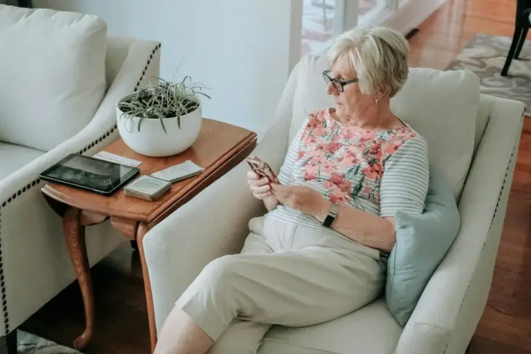 senior woman and phone