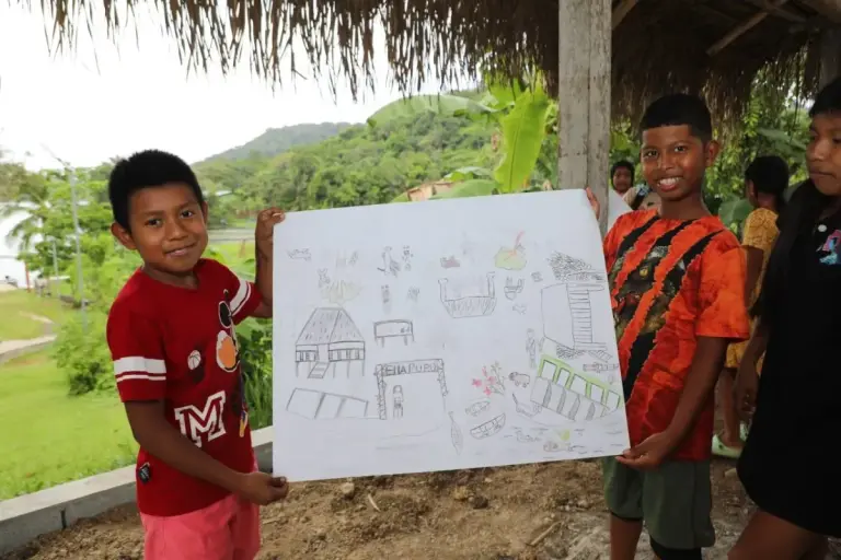 Emberá Ella Puru Indigenous Community Partners in Conservation Initiative comunidad Emberá Ella Puru kids showing drawing - Indigenous Community Partners in Conservation Initiative