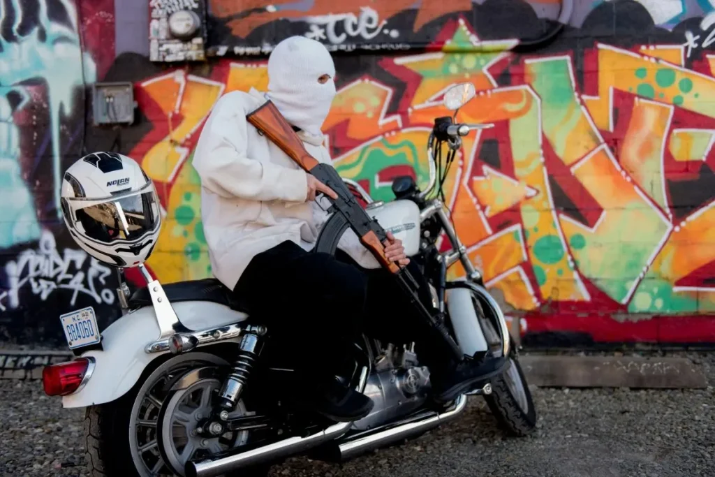 motorcycle rider with gun - youth homocides