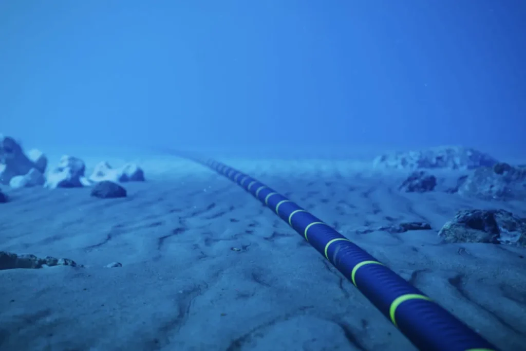 Submarine fiber optic cable on ocean floor